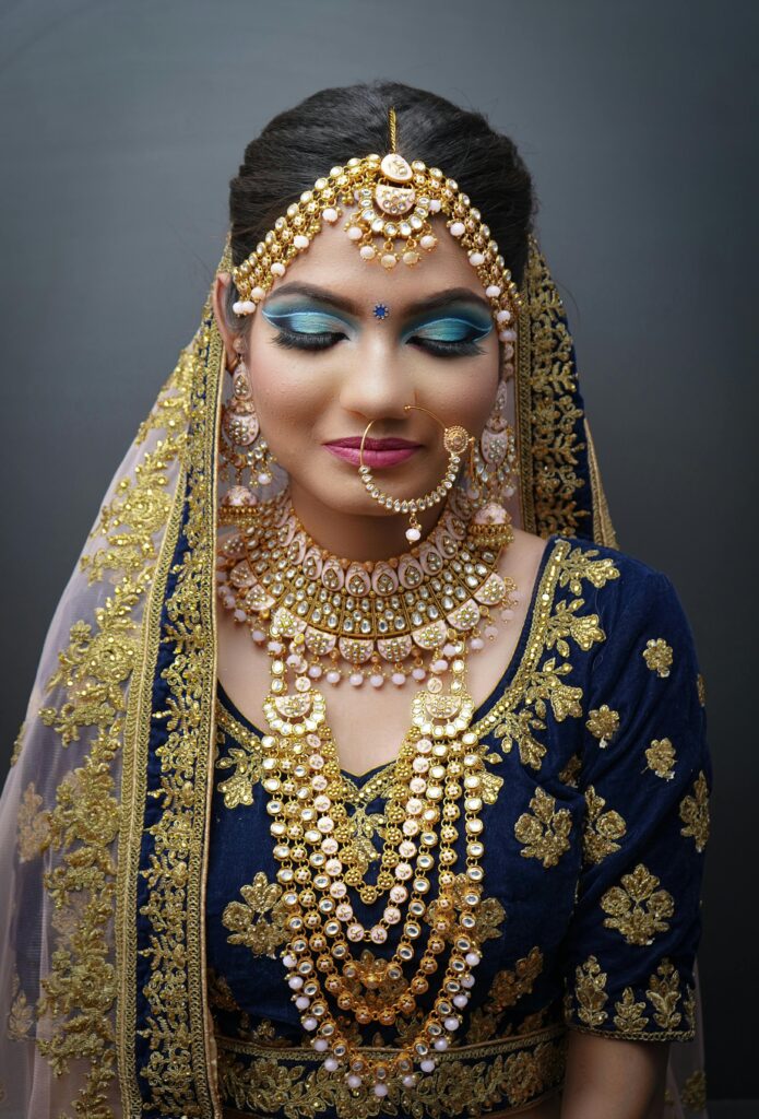 A traditional Indian woman in a luxurious sari and intricate jewelry, showcasing elegance and culture.